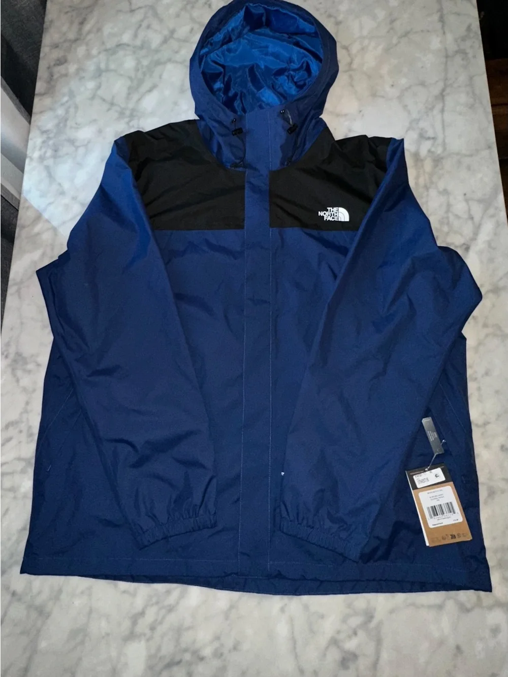The North Face Blue and Black Hooded Rain Jacket